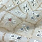 Mirror work embroidered fabric online india