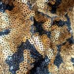 Buy Black and gold sequin fabric for garments online