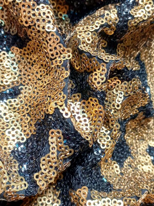 Buy Black and gold sequin fabric for garments online