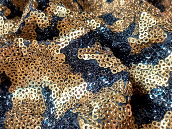 Gold and black sequin fabric for dress in india