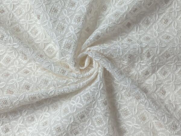 Buy Embroidered Schiffli fabric @ 330 INR
