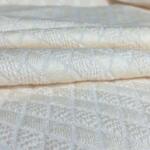 What is Designer Schiffli Embroidery Fabric