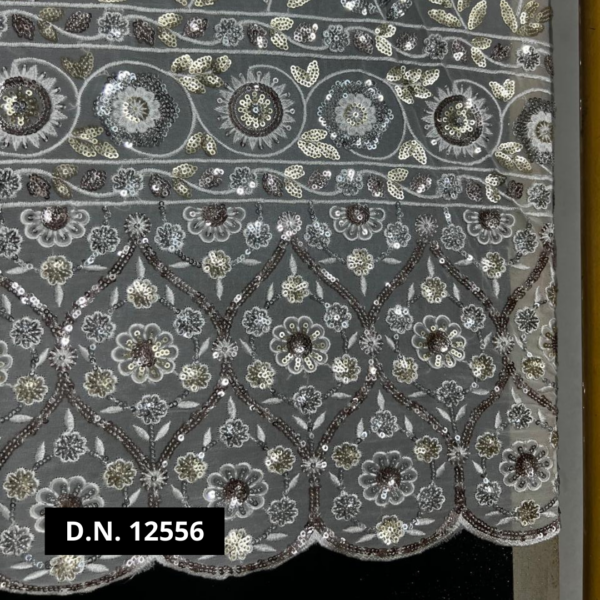 Georgette fabric with intricate embroidery for gowns and sarees.